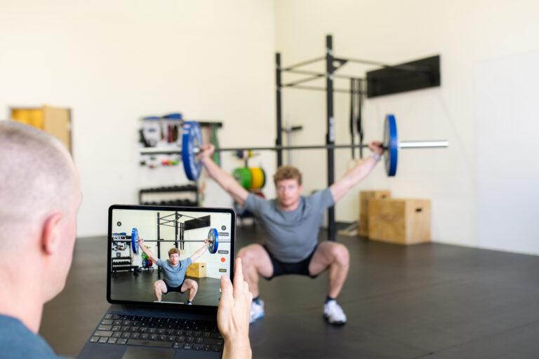 man recording weightlifting